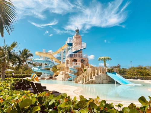 a water park with a water slide at 2BR Beachfront Unit w View - 62 in Bayahibe