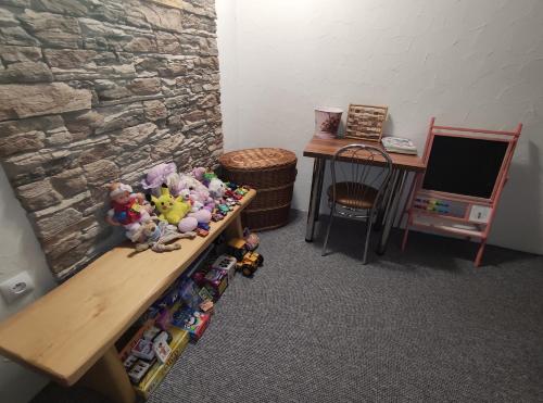 a room with a table with toys on it at Penzión Goraľka in Ždiar