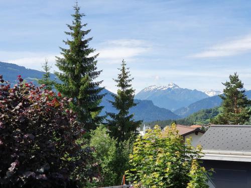 a group of trees in front of a mountain at Half chalet with garden & balcony - 2' to Ski bus in Laax