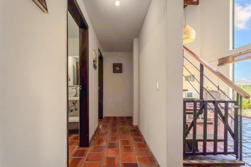 a hallway of a house with a staircase at La Villa, Espectaculares vistas al lago Peñol-Guatape in Guatapé