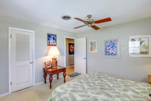 a bedroom with a bed and a ceiling fan at Spacious Home with Yard - half Mi to Ormond Beach! in Ormond Beach