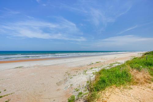 an empty beach with the ocean in the background at Spacious Home with Yard - half Mi to Ormond Beach! in Ormond Beach