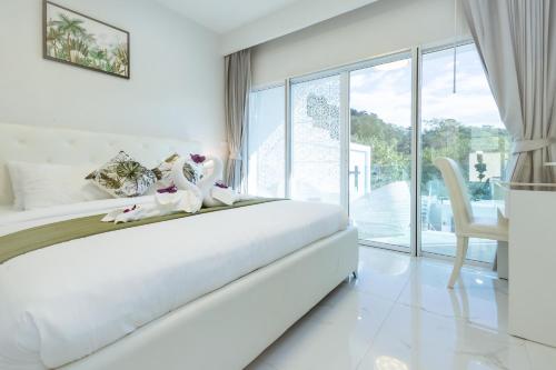 Postel nebo postele na pokoji v ubytování Koh Chang Luxury Pool Villas Premium