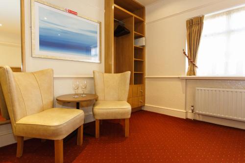 Ein Sitzbereich in der Unterkunft Morgan Hotel