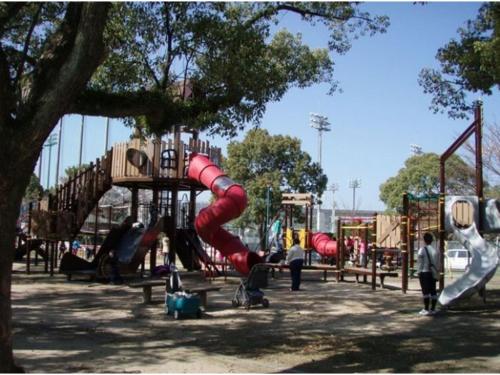 a playground with a red slide in a park at The Paradise Garden Sasebo - Vacation STAY 90006v in Sasebo