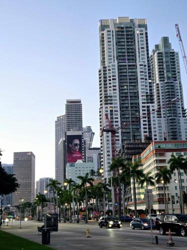 a city with tall buildings and a street with cars at Miami Myami Miamí Studio Apartment with Balcony in Miami