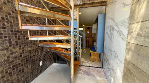 a room with wooden shelves in a wall at Eco Summer Tambaú WB Genius Flats in João Pessoa