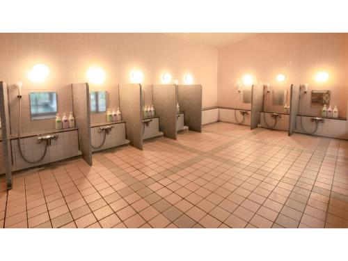 a bathroom with a row of urinals in a room at Le Nessa Akazawa - Vacation STAY 90007v in Futo