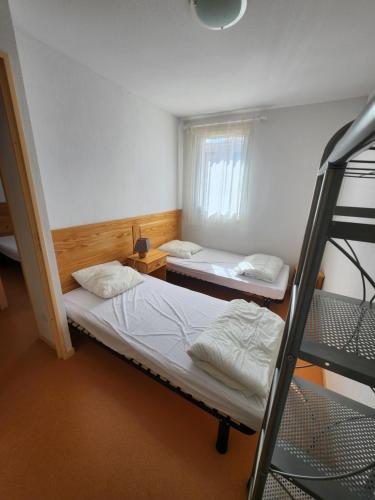 Кровать или кровати в номере Maison de vacance toute équipée