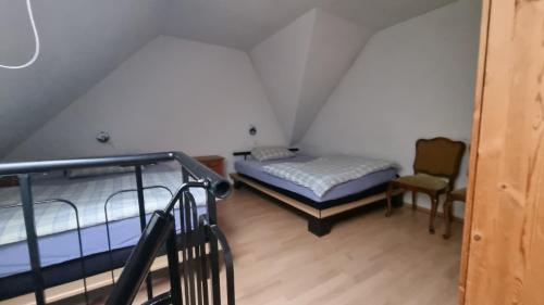 a room with two bunk beds and a staircase at Elfi's Appartments in Leichlingen