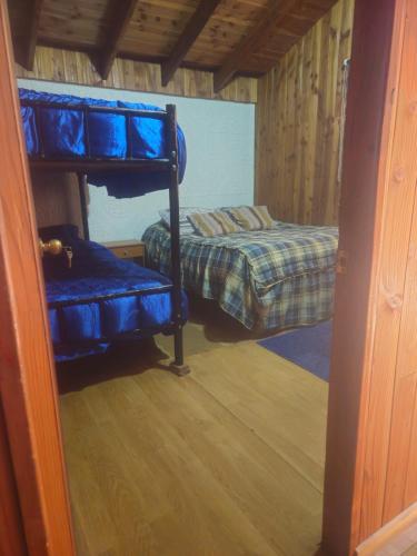 Postel nebo postele na pokoji v ubytování Hostal Maitahue