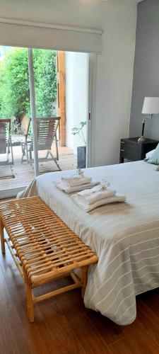 a large bed with towels on top of it at Casa Laprida in Mar del Plata