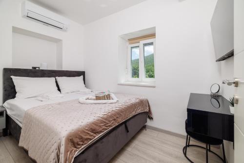 Ένα ή περισσότερα κρεβάτια σε δωμάτιο στο Villa Amnis