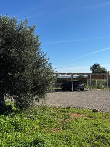 a car is parked in a parking lot at Quinta Castor in Vila Nova De Cacela