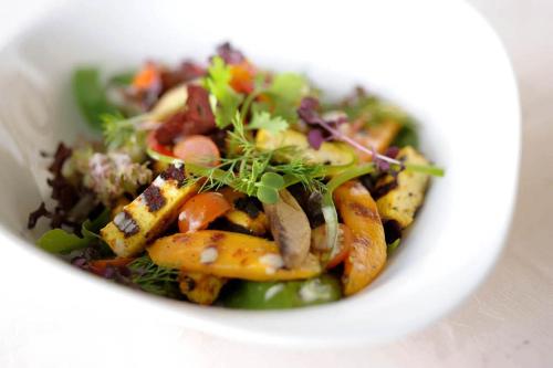 a white bowl of food with vegetables in it at Strandhaus Edersee Nr 12 - Kaminzimmer, Seeblick, Badestrand, Seeterrasse in Waldeck