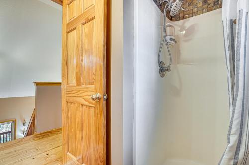 a room with a wooden door and a room with a room at Spacious Home in Helen with Porch and Balcony! in Helen