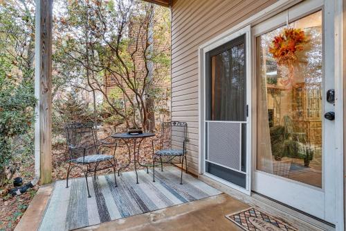 a porch with two chairs and a table next to a window at Spacious Home in Helen with Porch and Balcony! in Helen