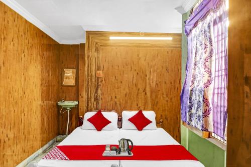 Ένα ή περισσότερα κρεβάτια σε δωμάτιο στο Hotel O Star Inn