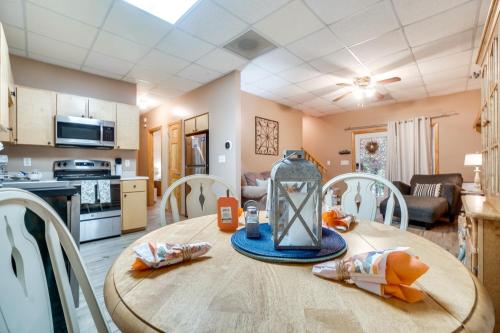 a kitchen and dining room with a table and chairs at Spacious Home in Helen with Porch and Balcony! in Helen