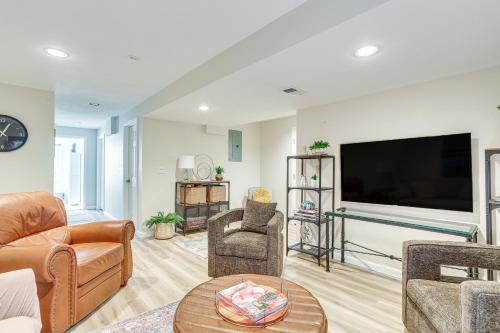 a living room with a large flat screen tv at Furnished Deck, Mountain View Castle Rock Home! in Castle Rock