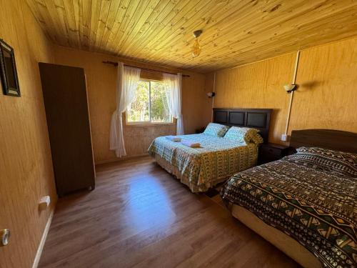 Postel nebo postele na pokoji v ubytování "Cabaña A y M"