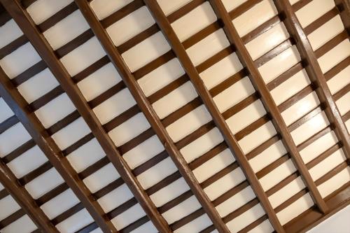 a close up of a wooden ceiling at Elegantis Trevi Suite Apartment - Just 50m from Trevi Fountain in Rome