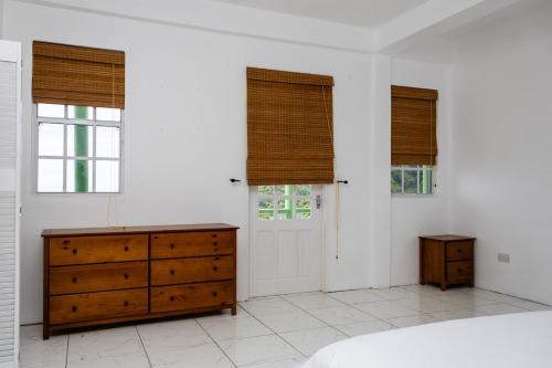 Ein Bett oder Betten in einem Zimmer der Unterkunft Sea and Summit Villa