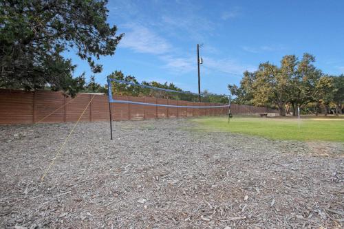 a volleyball court with a net in a park at Starlight Horizon 2 Cabins Hot Tub & Pool - Pet-Friendly Texas Hill Country Stay Near Canyon Lake Sleeps 12, Stargazing, Group Getaway in Canyon Lake