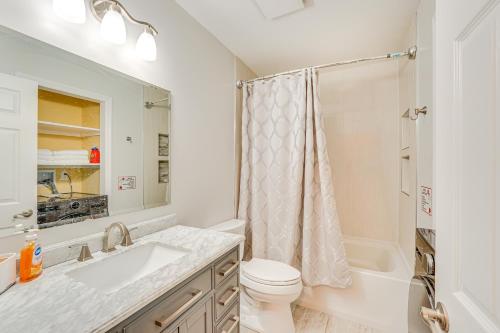 a bathroom with a sink and a toilet and a shower at 4 Mi to Hudson River Cozy Newburgh Home! in Newburgh