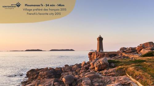 a picture of a lighthouse on a rocky shore at Granit & Vagues - Balcon vue mer, séjour à Trébeurden, front de mer in Trébeurden