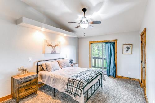 a bedroom with a bed and a ceiling fan at Spacious Afton Home Patio, Grill and Mountain Views in Afton