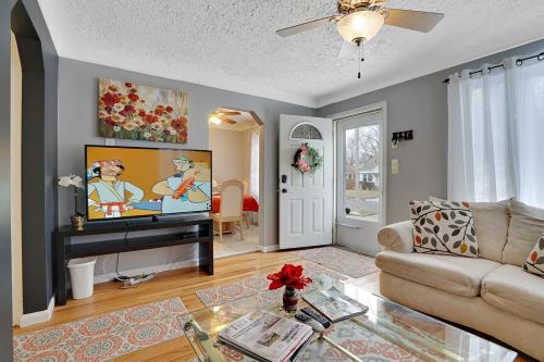 a living room with a couch and a tv at Super Cute & Cool Home with 65Inch TV 2Baths 4 Bedrooms 2King Beds BBQ Grill Fenced Backyard in Ferndale