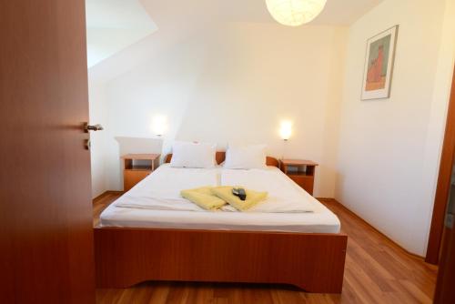 Ένα ή περισσότερα κρεβάτια σε δωμάτιο στο Apartman Molnár