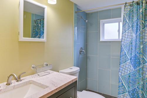a bathroom with a shower and a toilet and a sink at 2 Mi to UBS Arena WFH-Friendly Couples Retreat in South Floral Park
