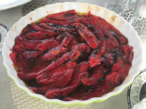 a red food in a pie dish on a table at Domek Walentinki in Rogacze