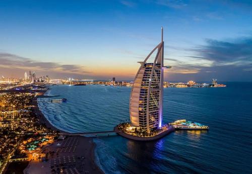 an aerial view of a tall building in the water at Premium Homestay in Business Bay in Dubai