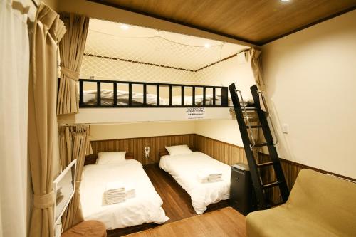 Postel nebo postele na pokoji v ubytování Mt Fuji Glamping TOURIST VILLA Kawaguchiko