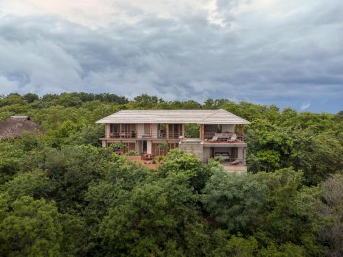 a house in the middle of a forest at Casa Queña, in the heart of Mazunte in Mazunte