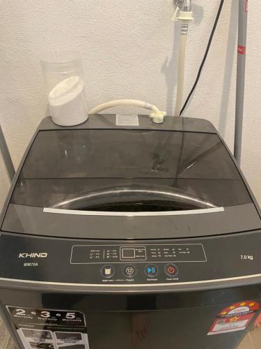 a toaster oven sitting on top of a appliance at NVilla Splashmania Gamuda Cove - Mayabay Residences in Banting