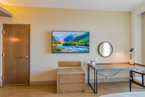 an office with a desk and a painting on the wall at Torre Lucerna Hotel Ensenada in Ensenada