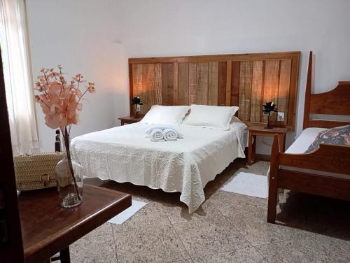 Postel nebo postele na pokoji v ubytování casa de mineiro