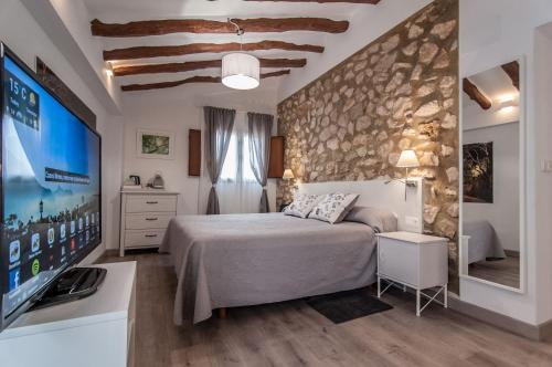 A bed or beds in a room at Cases Noves - Boutique Accommodation - Adults Only