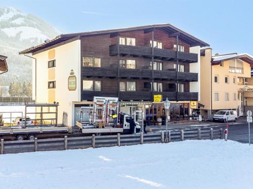a building with a truck parked in front of it at Brixen Alpin Living Top 9 und 10 in Brixen im Thale