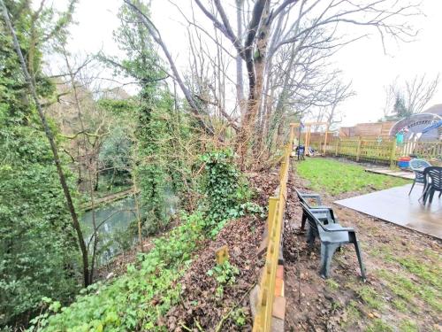 a bench in a park next to a fence at Yardley Lodge in Birmingham