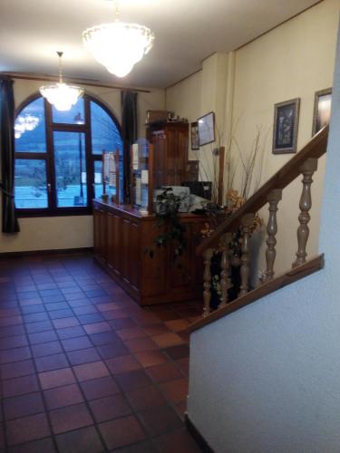 a room with a staircase and a room with a stair case at Tierra de la Reina in Boca de Huérgano