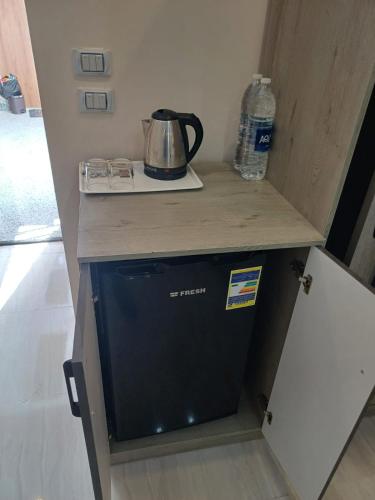 a dishwasher in a kitchen with a counter top at Hurghada Mirage Bay Hotel & Aquapark in Hurghada