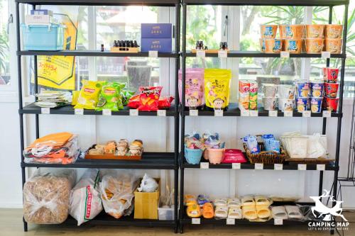 a shelf filled with lots of different food items at 99Glamping in Douliu