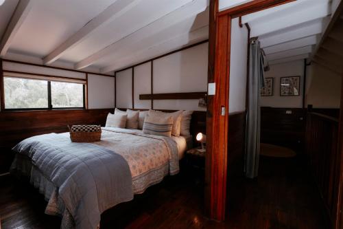 a bedroom with a bed and a window at Cottage 3 - The Row in Forest Grove