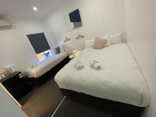 Postel nebo postele na pokoji v ubytování Central Motel Mudgee