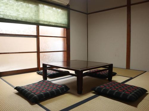Una cama o camas en una habitación de sano no yado - 佐野の宿 -